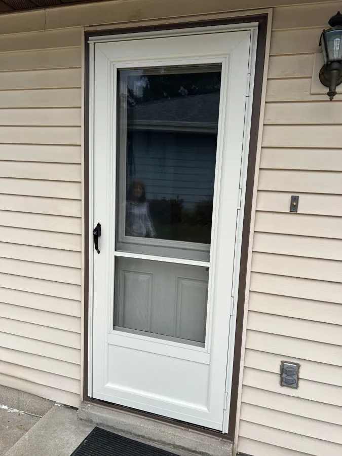 Waukesha WI exterior screen storm door replacement cream black push button closer Waukesha WI exterior screen storm door replacement cream black push button closer