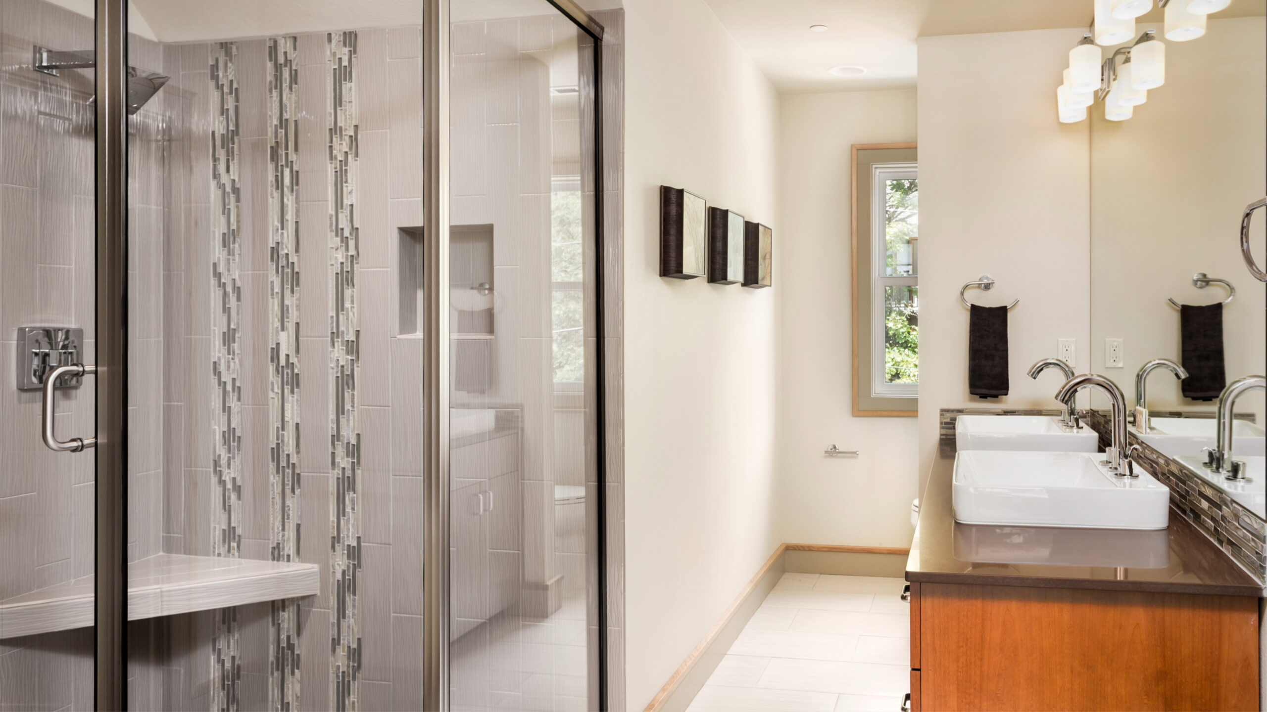 A white bathroom with a large gray walk-in shower